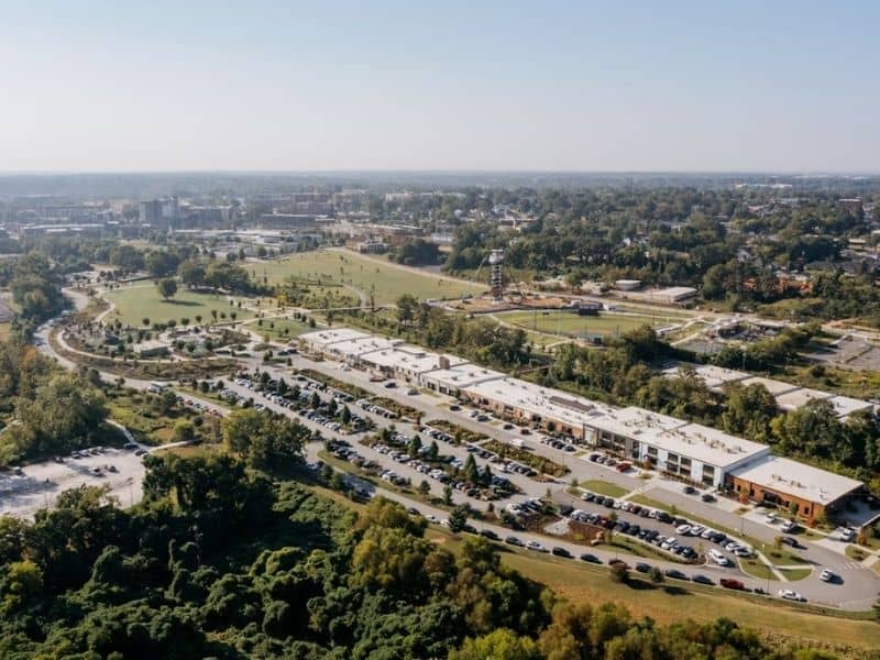 Aerial view of a commercial property with buildings, parking areas, and surrounding land relevant to an ALTA land survey